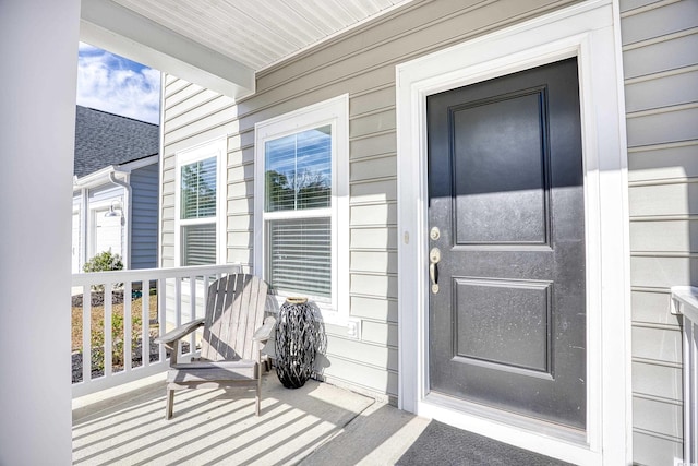 doorway to property featuring a porch