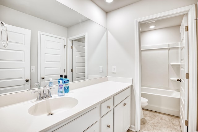 full bathroom with washtub / shower combination, tile patterned flooring, vanity, and toilet