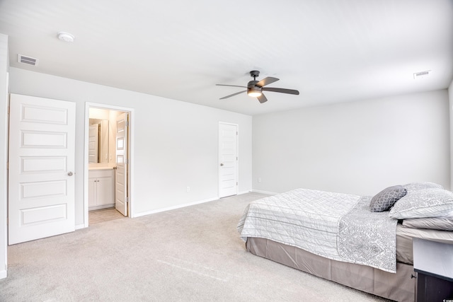 carpeted bedroom with connected bathroom, a closet, and ceiling fan