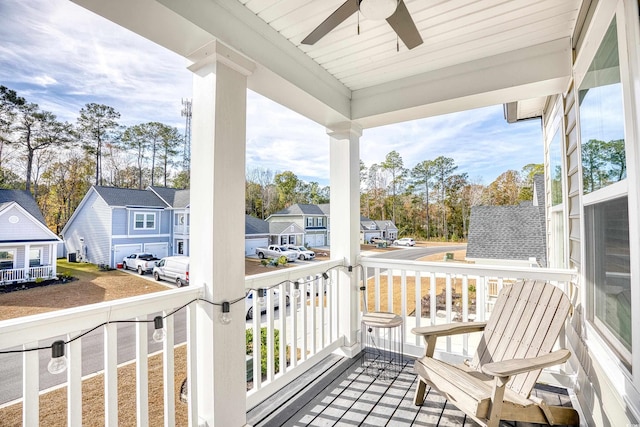 balcony with covered porch and ceiling fan