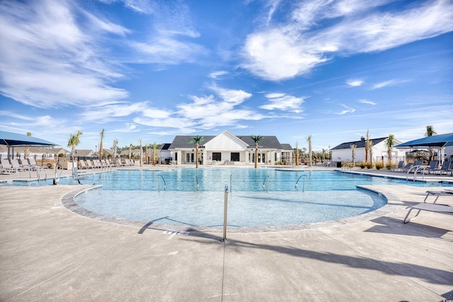 view of swimming pool featuring a patio area