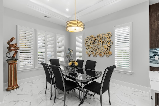 6105 Bolsena Pl, Myrtle Beach, SC 29577 - dining space with marble look tile flooring, a tray ceiling, and recessed lighting