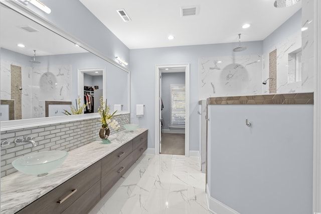 6105 Bolsena Pl, Myrtle Beach, SC 29577 - full bathroom with a marble finish shower, a walk in closet, marble look tiles, double vanity, and recessed lighting