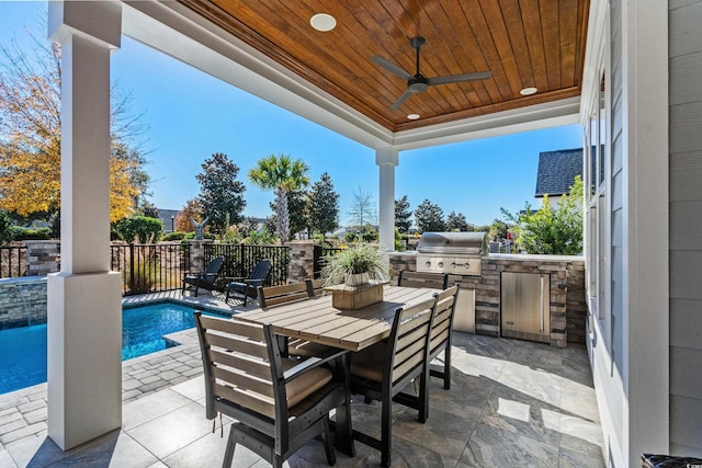 6105 Bolsena Pl, Myrtle Beach, SC 29577 - view of patio featuring an outdoor kitchen, outdoor dining space, and a ceiling fan