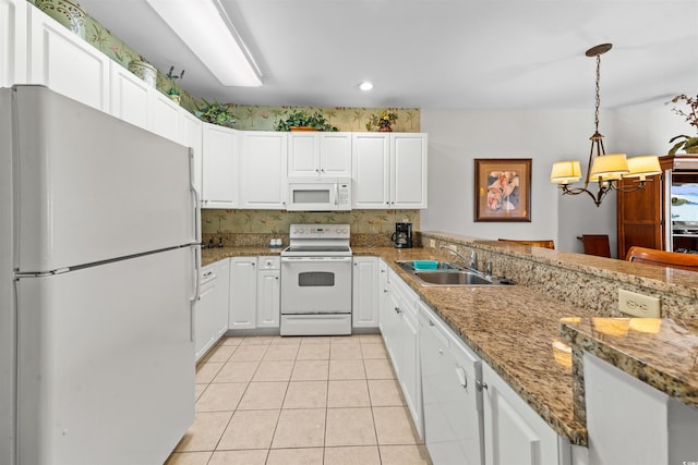 kitchen featuring white appliances, sink, light tile patterned floors, decorative light fixtures, and white cabinets