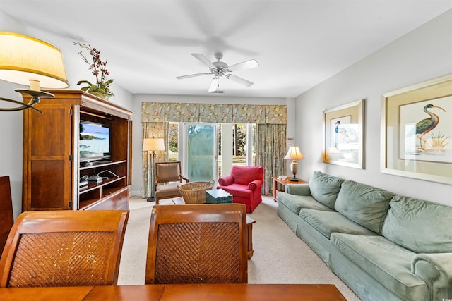 living room with light carpet and ceiling fan