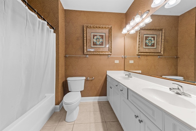 full bathroom featuring tile patterned flooring, vanity, toilet, and shower / tub combo with curtain