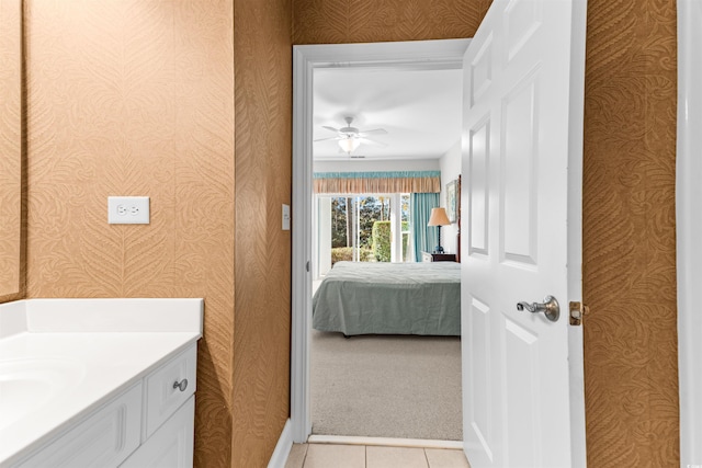 bathroom with tile patterned floors, ceiling fan, and vanity