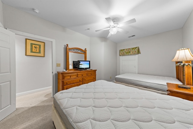 bedroom featuring ceiling fan and light colored carpet