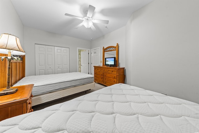 bedroom with ceiling fan and a closet