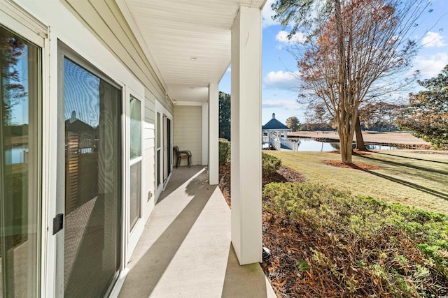 view of patio with a water view