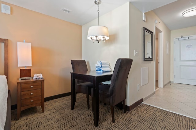 dining area featuring light tile patterned floors