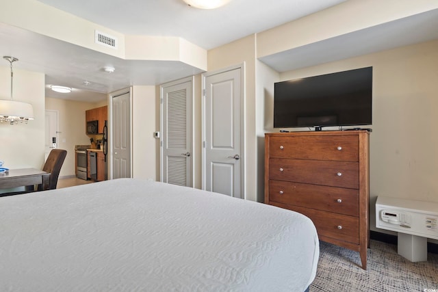 bedroom featuring multiple closets