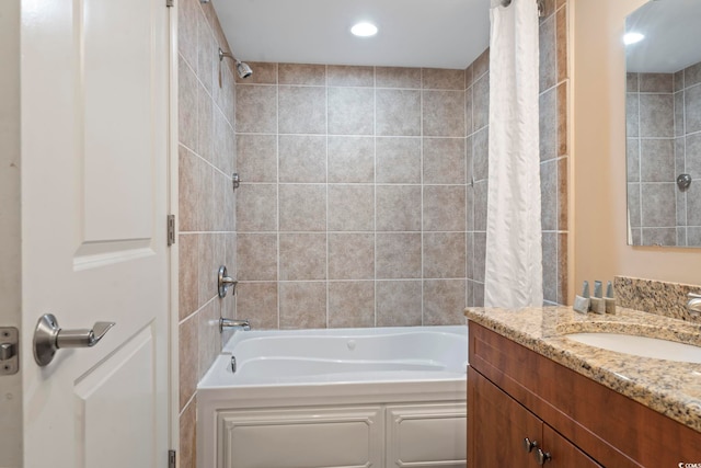 bathroom featuring vanity and shower / bath combo with shower curtain