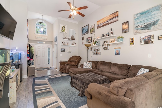 living room featuring ceiling fan, lofted ceiling, and dark wood-type flooring