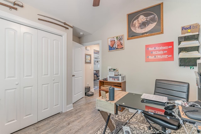 office space featuring light hardwood / wood-style floors, ceiling fan, and lofted ceiling