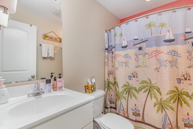 bathroom with vanity and toilet