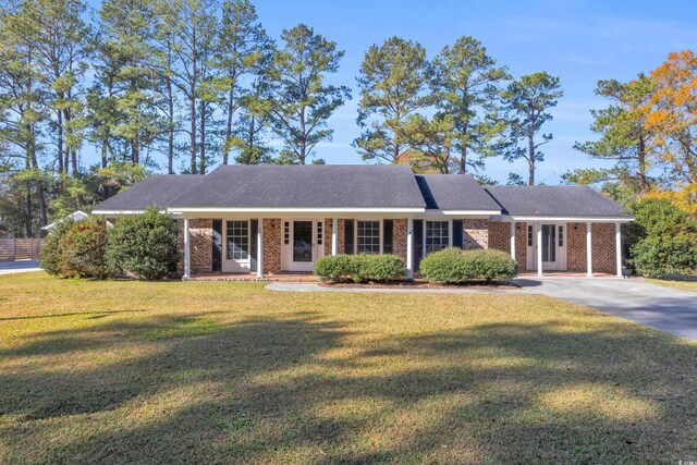 single story home with a porch and a front yard