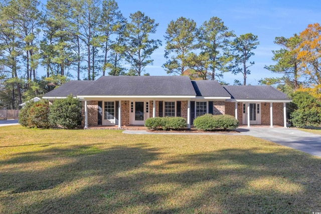 single story home with a porch and a front yard