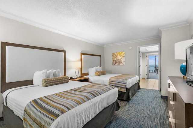 bedroom with a textured ceiling, crown molding, and tile patterned floors