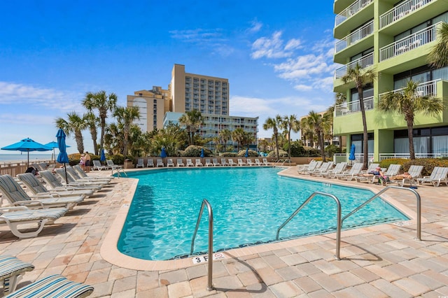 view of swimming pool featuring a patio area