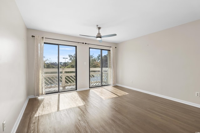 empty room featuring wood-type flooring and ceiling fan