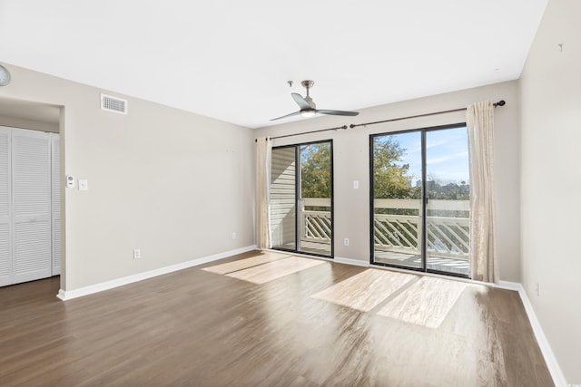 unfurnished room featuring ceiling fan and wood-type flooring