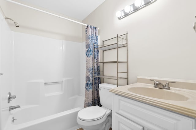 full bathroom featuring shower / bath combo, toilet, and vanity