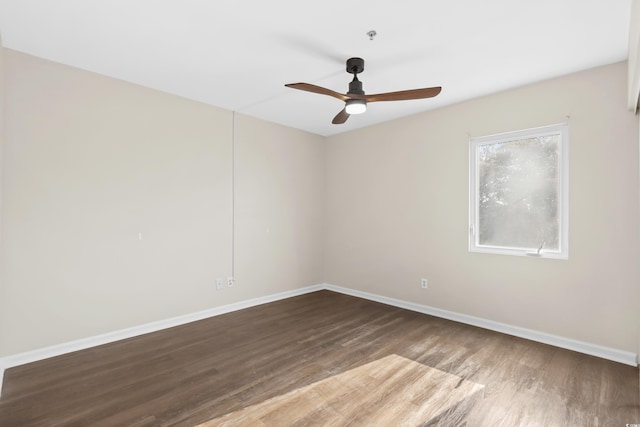 spare room featuring hardwood / wood-style flooring and ceiling fan