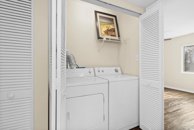 washroom with separate washer and dryer and hardwood / wood-style floors