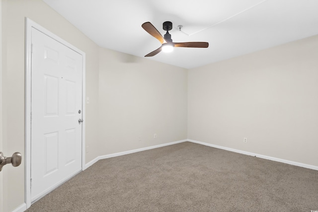 spare room featuring carpet flooring and ceiling fan