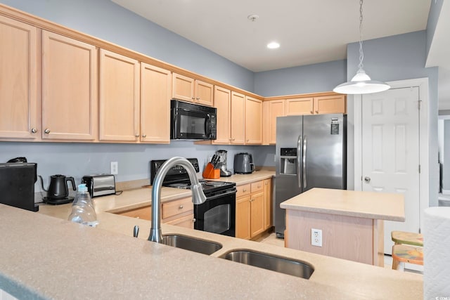 kitchen with light brown cabinetry, hanging light fixtures, and stainless steel appliances