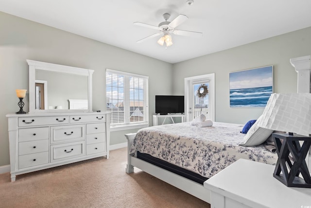 bedroom with light colored carpet and ceiling fan