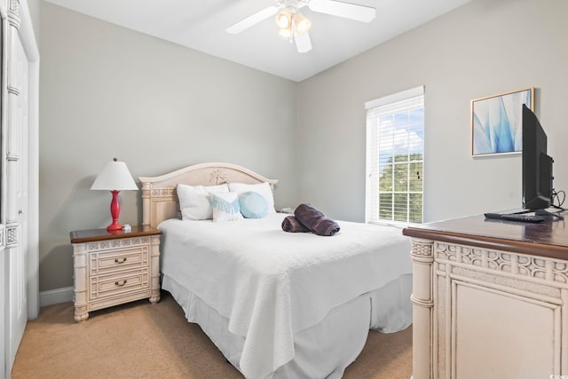 carpeted bedroom featuring ceiling fan