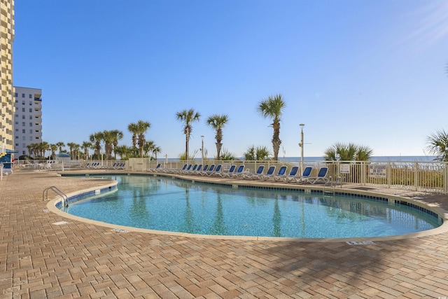 view of swimming pool with a patio