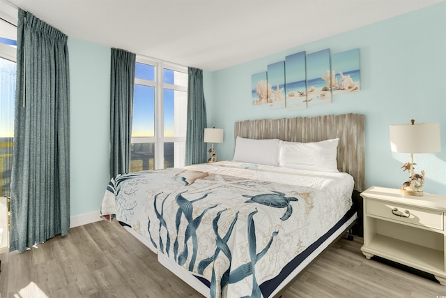 bedroom with light wood-type flooring