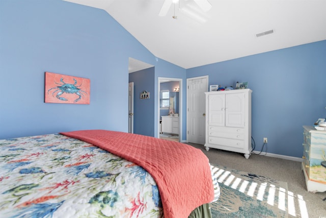 bedroom featuring ceiling fan, ensuite bathroom, lofted ceiling, and carpet floors