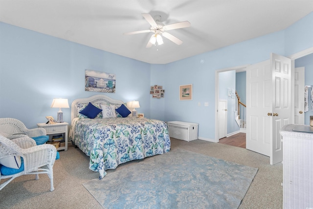 bedroom with ceiling fan and carpet floors