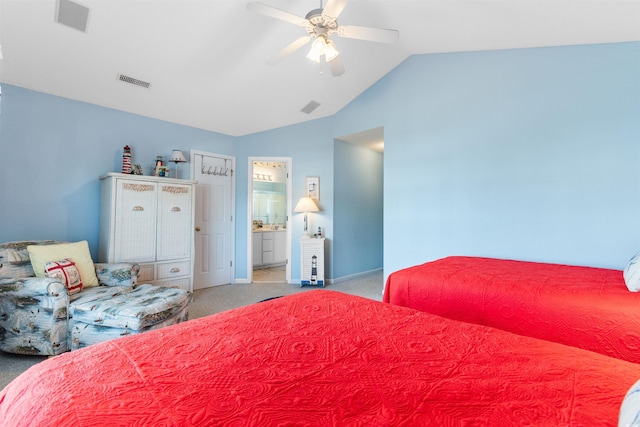 carpeted bedroom featuring ceiling fan, vaulted ceiling, and ensuite bathroom