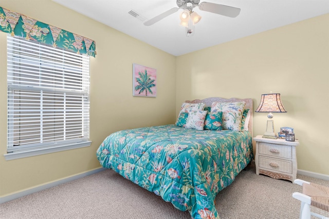 carpeted bedroom featuring ceiling fan