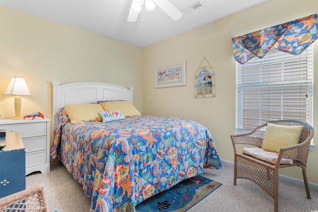 bedroom with ceiling fan and light carpet