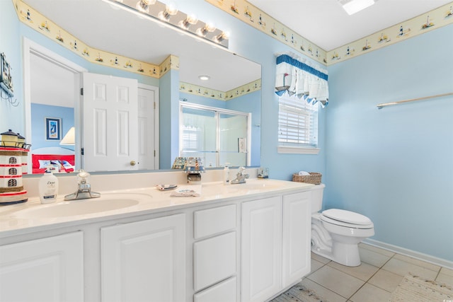 bathroom featuring toilet, tile patterned floors, an enclosed shower, and vanity