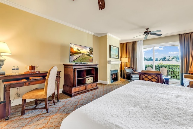 8121 Amalfi Pl Unit 5-103, Myrtle Beach, SC 29572 - carpeted bedroom featuring baseboards, ornamental molding, a lit fireplace, and ceiling fan