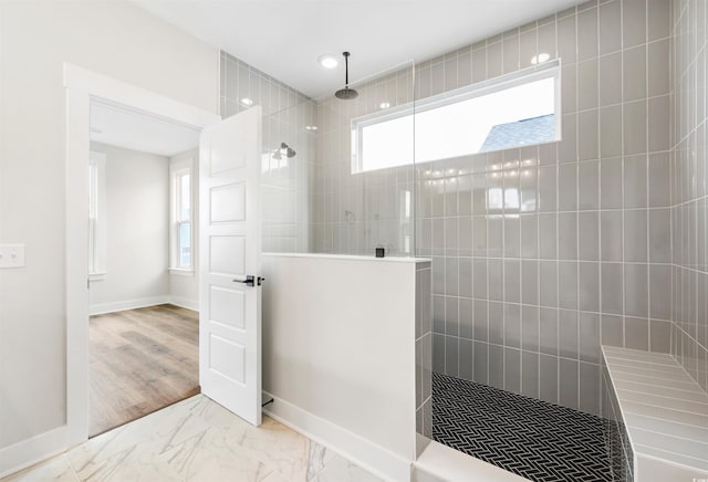 bathroom featuring a tile shower