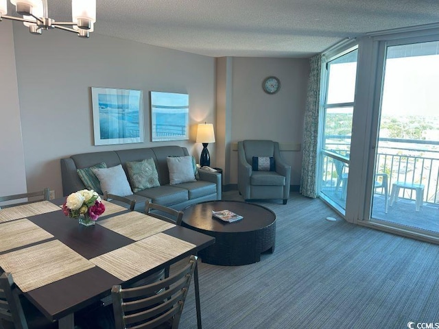 2301 S Ocean Blvd Unit 1002, North Myrtle Beach, SC 29582 - living area featuring a chandelier, carpet flooring, and a textured ceiling
