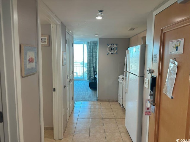 2301 S Ocean Blvd Unit 1002, North Myrtle Beach, SC 29582 - hallway with light tile patterned floors and baseboards