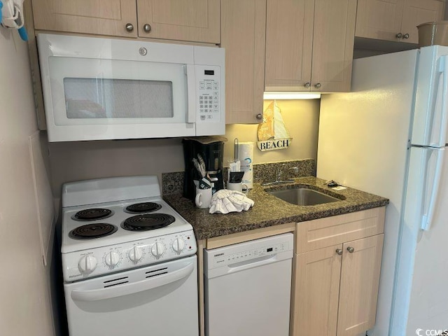 2301 S Ocean Blvd Unit 1002, North Myrtle Beach, SC 29582 - kitchen featuring white appliances and dark stone countertops