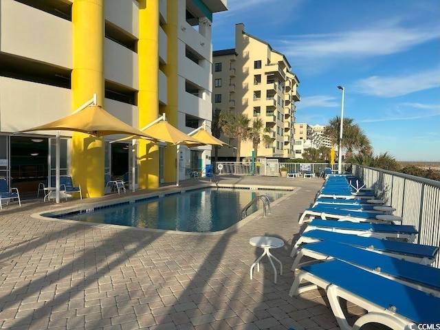 view of swimming pool featuring a patio