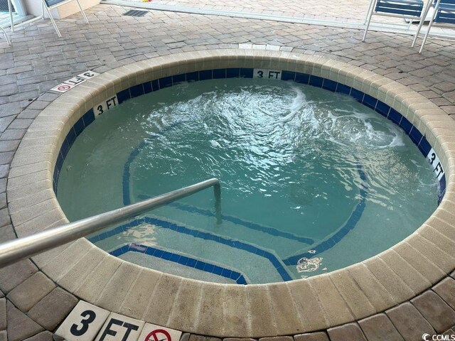2301 S Ocean Blvd Unit 1002, North Myrtle Beach, SC 29582 - view of swimming pool with a community hot tub and a pool
