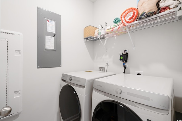 laundry area with separate washer and dryer and electric panel